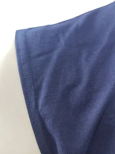 High-quality close-up of navy blue sports fabric featuring durable double-stitched hem detail.