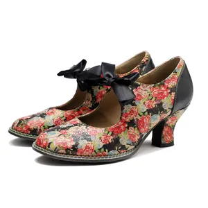 Detail view of vintage American pastoral floral high heels with a black silk bow tie.