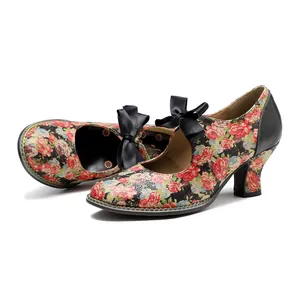 Detailed view of vintage floral high heels featuring an elegant black ribbon bow