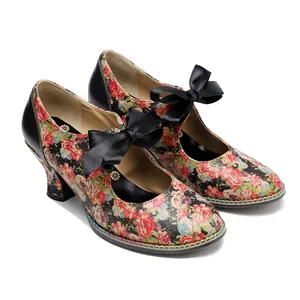 Close-up view of vintage floral print high heels featuring elegant black ribbon bow decoration.