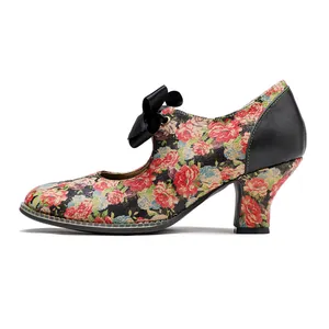 Detailed side view of vintage floral Mary Jane high heels with elegant black bow accent