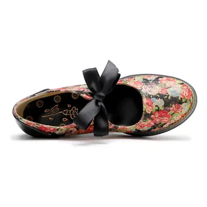 Top-down detailed view of vintage American pastoral floral shoe with black satin ribbon bow