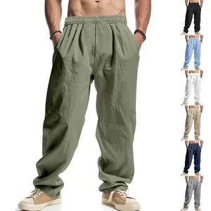 Detailed view of men's loose linen trousers showing the fit and multiple color variants