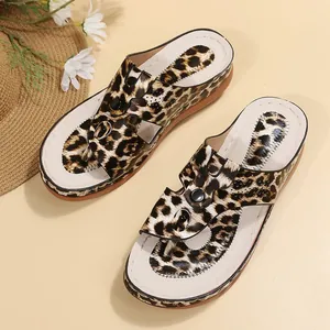 Detailed top view of stylish leopard print wedge thong sandals for summer beach wear