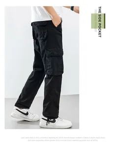 Side view of black loose-fit cargo pants with functional large side pockets