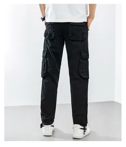 Detailed back view of black cargo pants with multiple large functional pockets for men