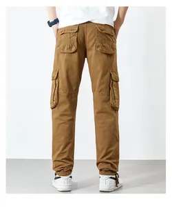 Rear view of men's loose brown cargo pants with large functional pockets and straight cut.