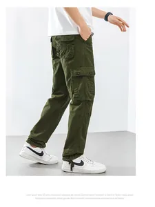 Detailed view of men's loose straight leg cargo pants in olive green with large pockets