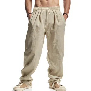Detailed view of men's casual loose linen pants featuring a drawstring waist and wide-leg design.