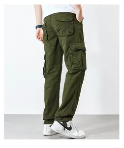 Detail view of military green cargo pants with large side pockets and drawstring hem.