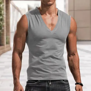 Detail view of a men's grey solid color V-neck sleeveless tank top on model