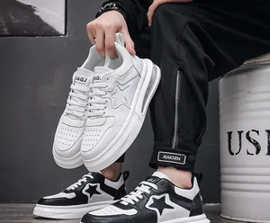 Side profile of black and white air cushion sneakers with star logo and thick sole