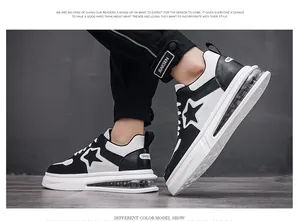 Detail view of men's black and white air-cushioned skate shoes with star design