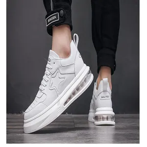 Detailed side view of white men's air cushion sneakers featuring a star pattern and clear sole