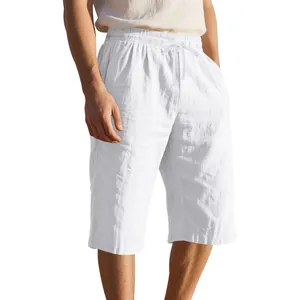 Detailed view of men's breathable white linen cropped shorts featuring a drawstring waist