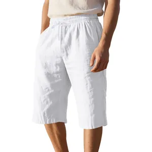 Close-up of men's white breathable linen shorts featuring an elastic drawstring waistband.