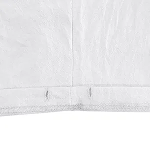 Macro view of stitching and linen texture on white men's beach shorts