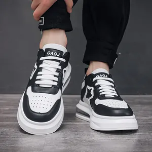 Stylish men's black and white color-block air cushion sneakers with side star detail