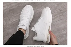 Detailed side view of white men's casual sneakers with visible air cushion sole