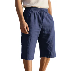 Detail view of navy blue linen shorts with drawstring waist and loose fit