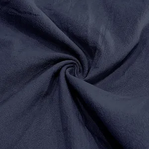 Macro detail of breathable navy blue linen fabric texture for men's summer casual pants