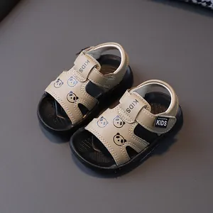 Close-up detail of beige toddler sandals featuring cute panda print and soft non-slip soles