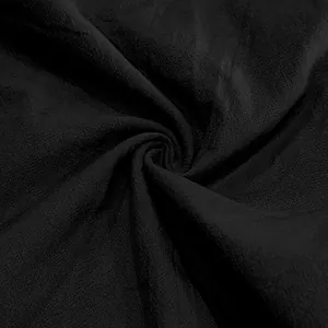 Macro view showing the breathable and lightweight texture of black linen fabric