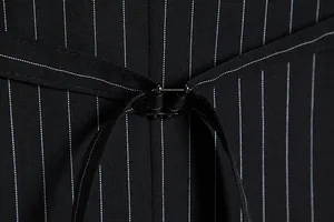 Detail shot of men's pinstripe vest showing back cinch buckle and fabric texture.