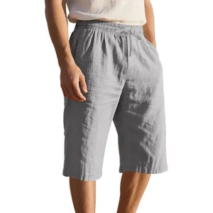 Detail of grey men's linen shorts showing drawstring waist and loose texture.