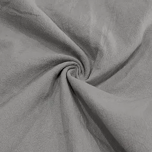 Detailed macro view of gray breathable linen fabric texture for men's casual pants