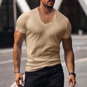 Close-up of a muscular man wearing a khaki slim-fit V-neck short sleeve T-shirt.