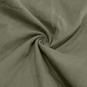 Detailed texture of breathable olive green linen fabric for men's summer casual shorts