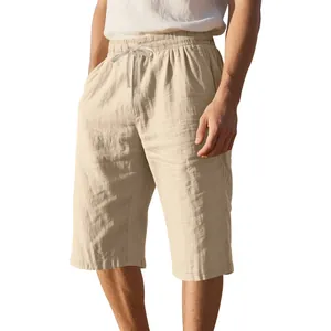 Detail view of linen fabric and adjustable drawstring on men's beige beach shorts