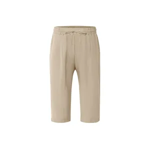 Detail view of men's khaki linen cropped trousers with elastic drawstring waistband