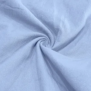 Detail showing the breathable light blue linen fabric texture for men's summer casual pants
