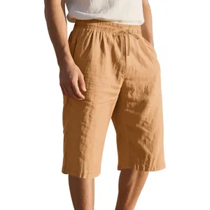 Detailed view of men's loose linen shorts with breathable texture and drawstring waist.