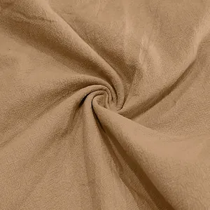 Close-up macro detail showing breathable khaki linen fabric texture for men's casual beach shorts