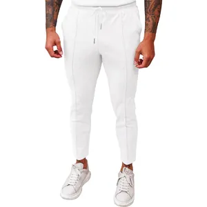 Detailed view of men's white waffle knit casual pants with elastic drawstring waistline