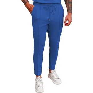 Detail shot of men's blue waffle knit drawstring casual pants with straight leg cut