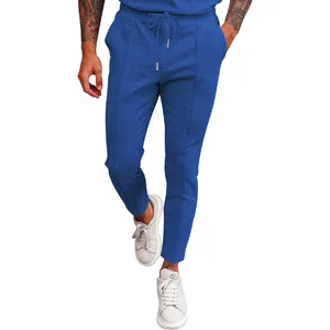 Detail of blue waffle knit men's leisure pants with drawstring and elastic waist