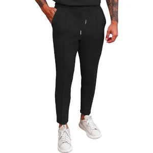 Close-up of black waffle knit men's casual pants with drawstring waist and straight leg