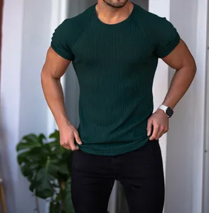 Close-up detail of dark green ribbed slim fit T-shirt for men showing high-elastic fabric texture
