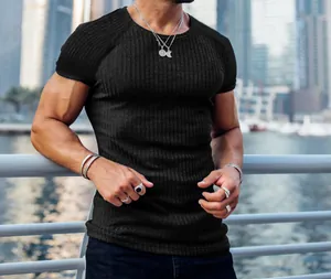 Detailed shot of men's black ribbed short-sleeve t-shirt for fitness and casual wear