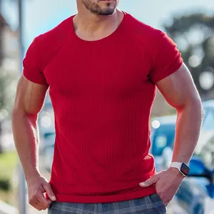 Detail view of red muscle fit t-shirt featuring a vertical ribbed stretch fabric