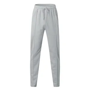 Close-up detail of light grey men's waffle knit casual pants with drawstring elastic waist