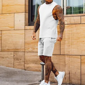 Side view detail of a white men's sports vest and matching sweatshorts on a model