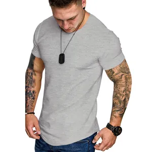 Detailed close-up of a gray slim fit crew neck athletic t-shirt on a male model