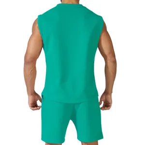 Rear view of men's green sleeveless athletic set showing fit and fabric texture