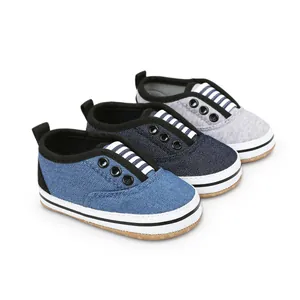 Detail of three different colors of soft-sole canvas baby walking shoes for infants.