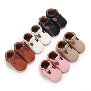 Group of colorful soft-sole baby Mary Jane shoes neatly arranged on a white backdrop